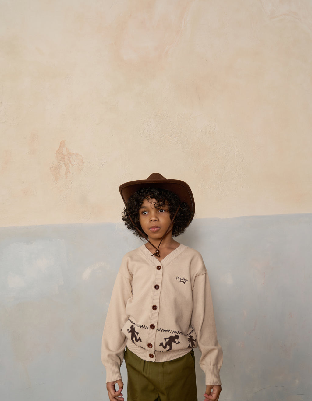 Kids Cotton Knit Runningman Cardigan on model